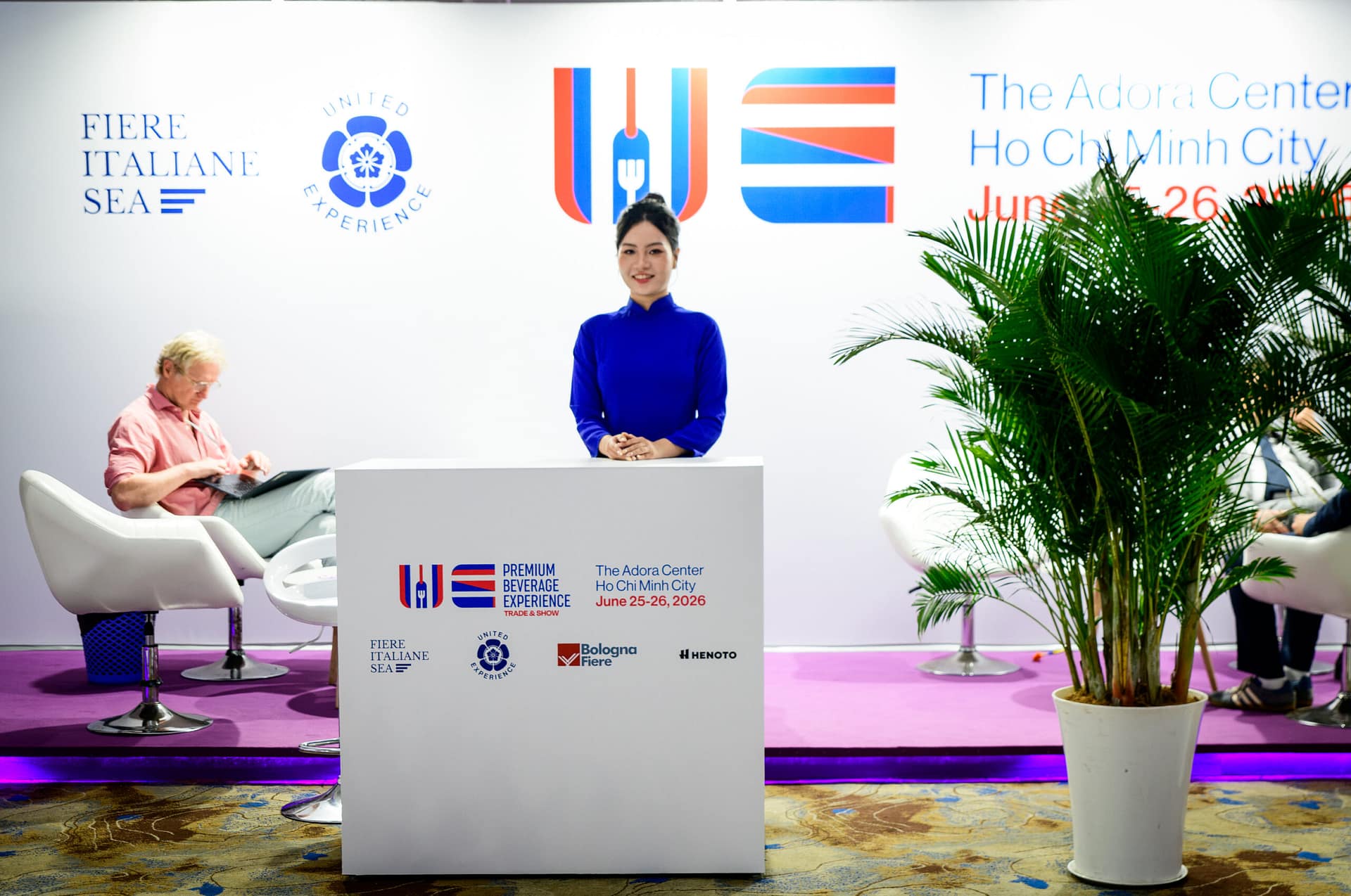 Welcome and registration desk at Wines Experience HCMC 2026, Adora Center, with Fiere Italiane SEA and United Experience logos