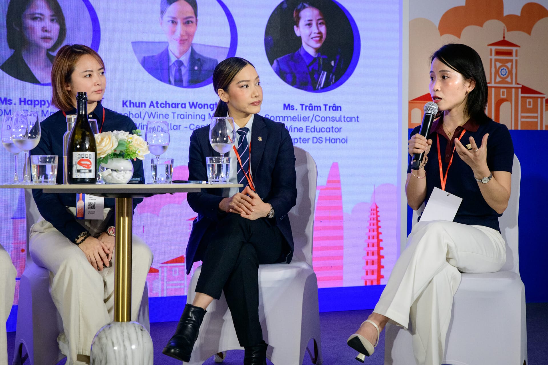 Happy Gan (DC Selections, Kuala Lumpur), Khun Atchara Apple Wongthai Palleros (Central Food Retail Thailand) and Ms. Trâm Tran (Vietnam Sommelier Association) on stage during the Next Generation Wine Consumer panel at Wines Experience Ho Chi Minh City 2026
