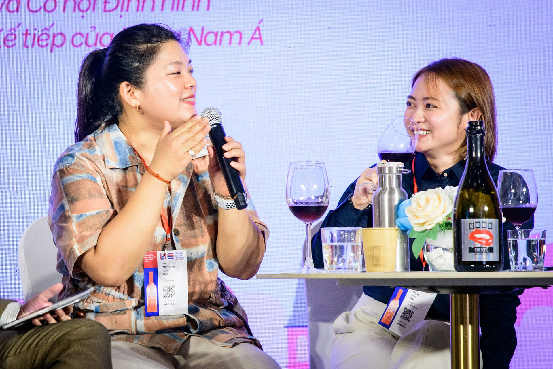 Ms. Minyoung Ryu (Head Sommelier, Potato Head Family, Bali) and Ms. Happy Gan (DC Selections, Kuala Lumpur) sharing a light moment during the wine tasting at the Next Generation Wine Consumer panel, Wines Experience Ho Chi Minh City 2026