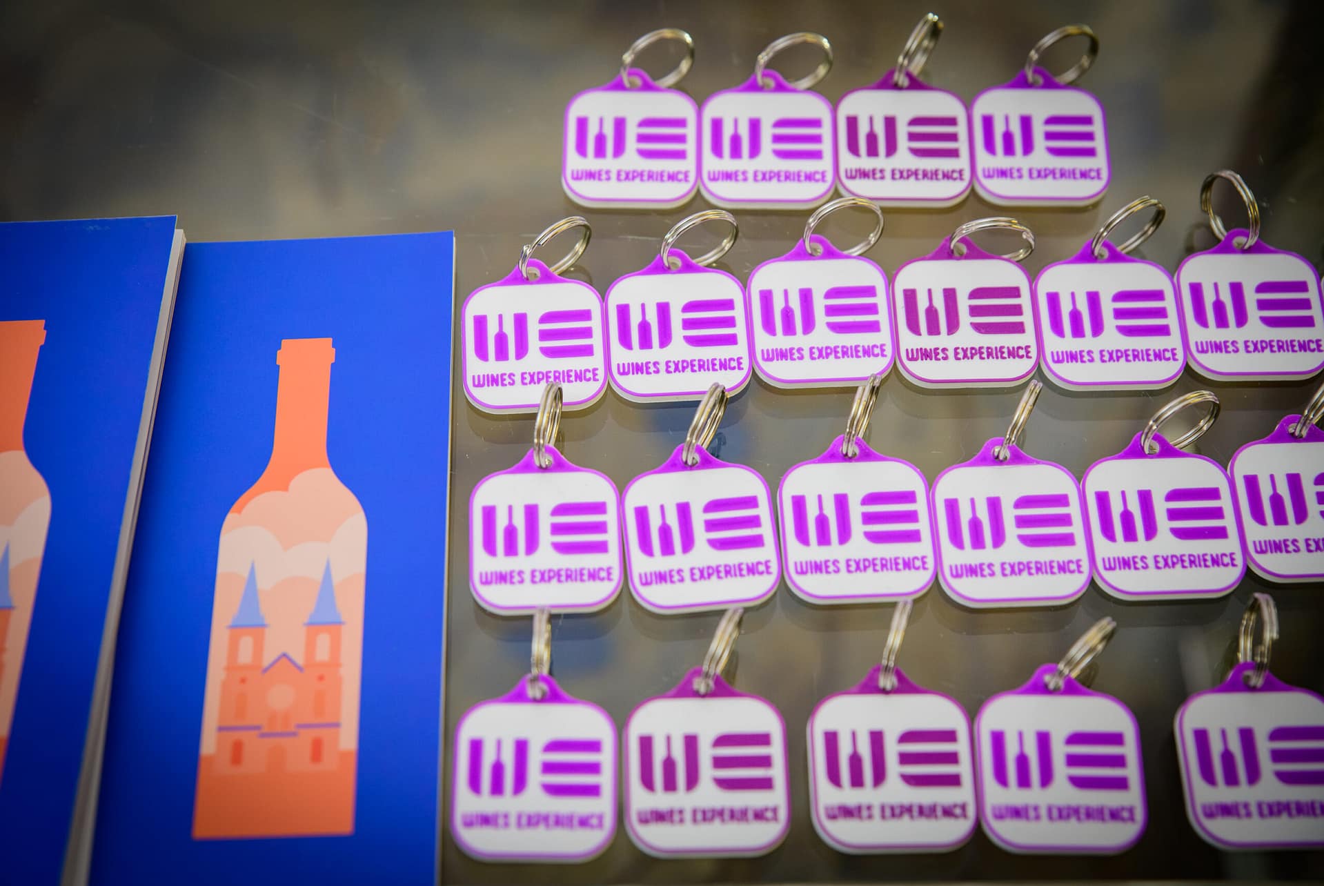 Wines Experience branded keychains as event merchandise, HCMC 2026